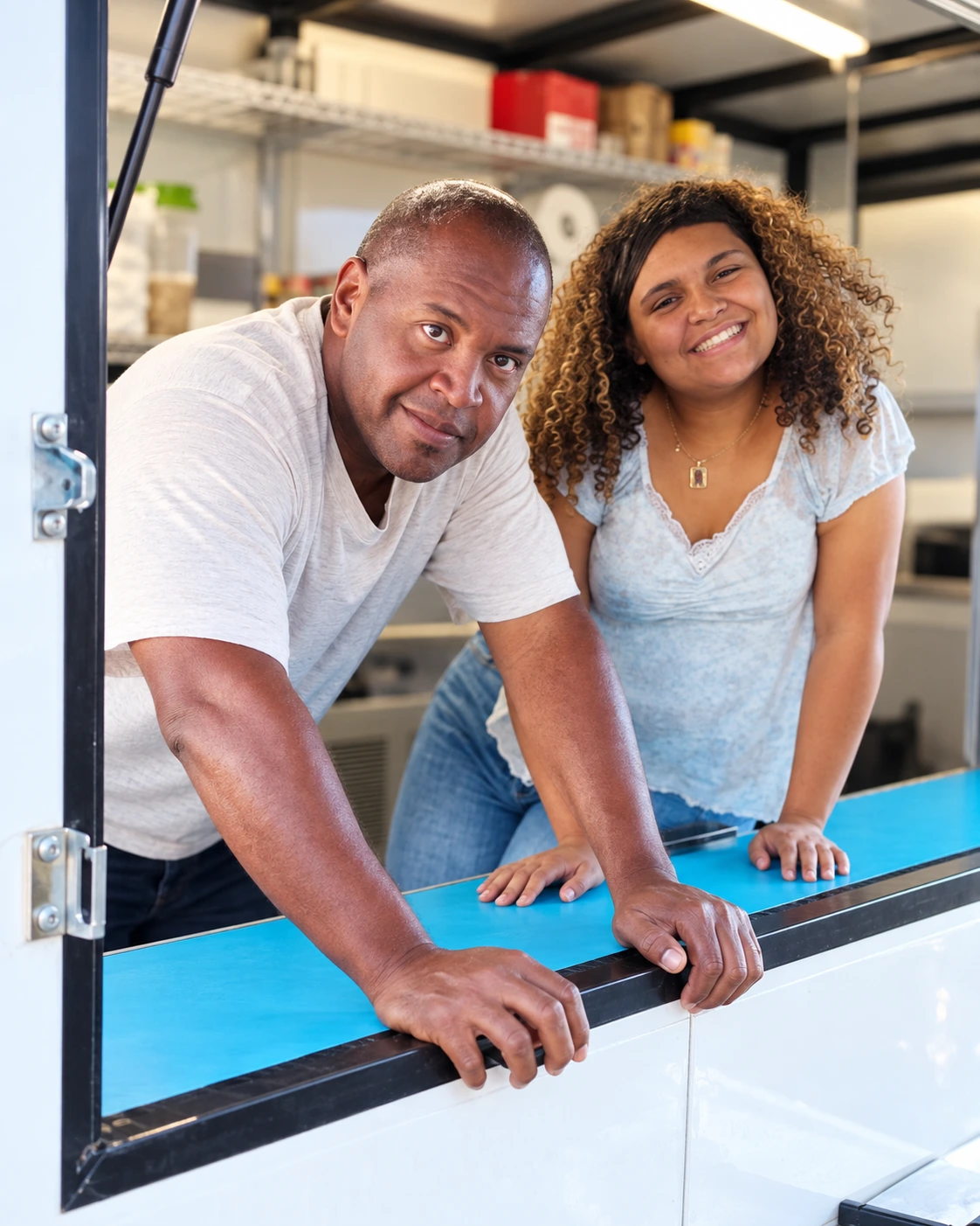 Demetrius and Eliza welcoming customers from the Dance Dad’s Barbecue truck