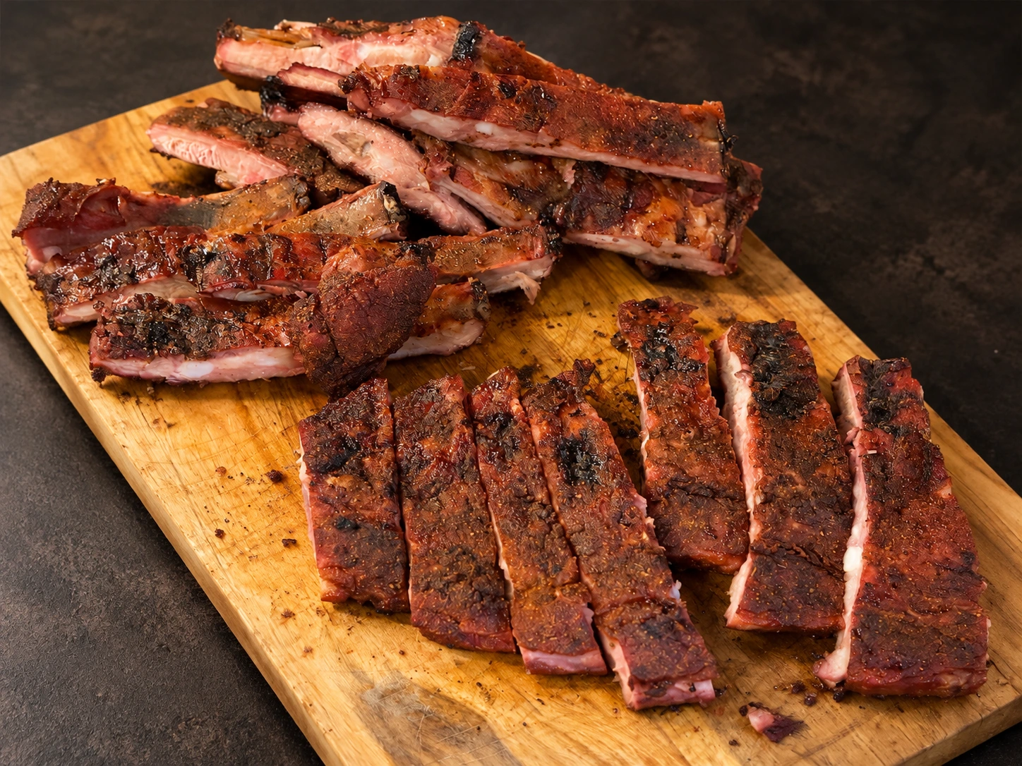 Dance Dad’s barbecue ribs on a wooden cutting board